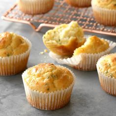 several muffins are sitting on a cooling rack