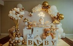 a baby shower with teddy bears and balloons