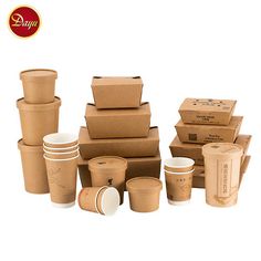 there are many boxes and cups stacked on top of each other