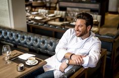 a man sitting at a table in a restaurant