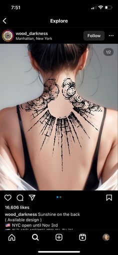 the back of a woman's neck with tattoos on it