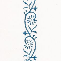 a blue and white embroidered design on a white background