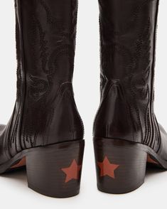 Expertly crafted for Western -style and durability, our SALOON boots feature a pointed toe, knee-high silhouette, and whipstitching detailing. The sturdy block heel with a star detail adds a touch of unique charm while providing comfortable support. Elevate your wardrobe with these timeless, versatile boots.  2.5 inch heel height Size 6 measurements: 14.25 inch shaft circumference, 12.5 inch shaft height Size 8 measurements: 14.75 inch shaft circumference, 12.75 inch shaft height Size 10 measurements: 15.25 inch shaft circumference, 13 inch shaft height   Leather upper material Leather lining Leather sock Synthetic sole Fit tip: If you are in between sizes, size up a half-size Imported