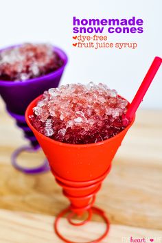 two purple and red bowls filled with ice on top of a wooden table next to each other