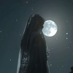 a woman standing in front of a full moon with her veil draped over her head