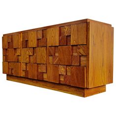 a large wooden cabinet with many squares on the front and sides, made out of wood