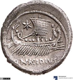 an ancient coin with the image of a ship on it's side and symbols