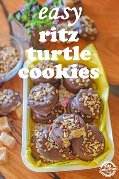 chocolate covered turtle cookies on a table with other treats in the background and text overlay that reads easy ritz turtle cookies