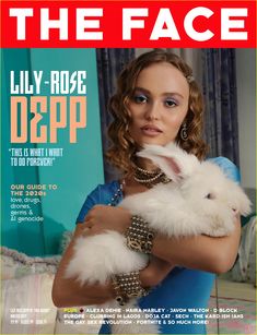 the face magazine cover features a woman holding a white rabbit in her arms and wearing jewelry