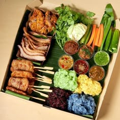 an open box filled with meat and vegetables