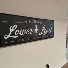 a sign that says welcome to our lover level on the wall in an office lobby