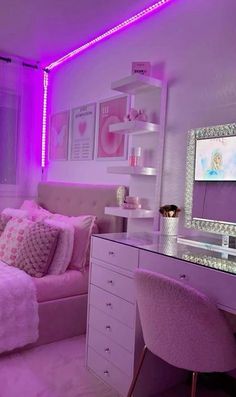 a bedroom with purple lighting and pink furniture in the corner, along with a white bed