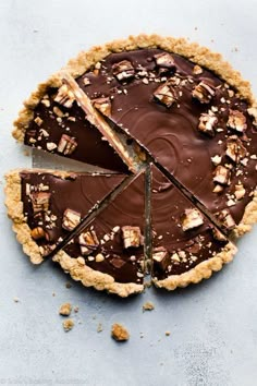 a chocolate tart pie with one slice cut out