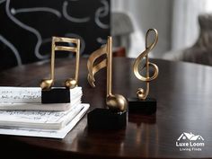 three musical notes are sitting on a table