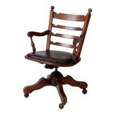 an old wooden chair with leather seat and casteor wheels on a white back ground