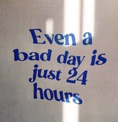 a sign that says even a bad day is just 24 hours