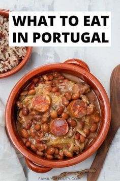 two bowls filled with beans and rice next to a wooden spoon