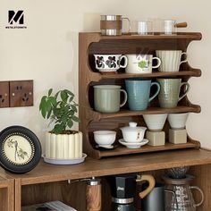 a wooden shelf filled with cups and saucers