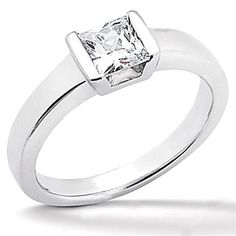 a white gold ring with a princess cut diamond