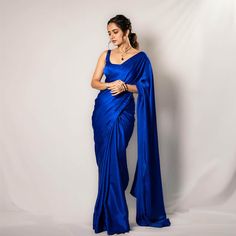 Ashika Ranganath dazzles in the trailer launch of Avatarapurusha 2 wearing a plain blue saree, setting the stage for a captivating narrative. Blue Satin Saree Look, Royal Blue Saree Look, Plain Saree Look, Electric Blue Saree, Blue Saree Look, Royal Blue Indian Outfit, Plain Satin Saree, Blue Indian Outfit, Dark Blue Saree