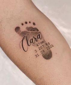 a close up of a person's arm with a tattoo on it that says clara