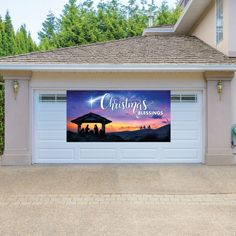 a garage with a christmas card on the side and an image of three people in a nativity scene