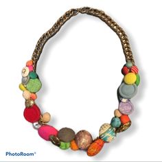 a necklace with many different beads on it