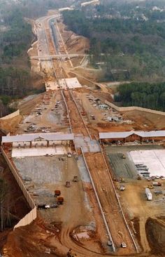 an aerial view of a construction site in the woods