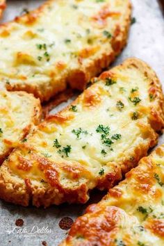 cheesy bread with cheese and parsley on the top is ready to be eaten