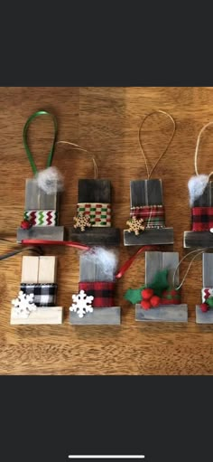 christmas ornaments made out of wooden blocks on a table