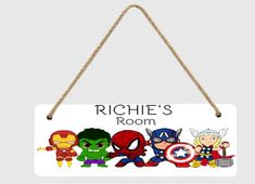 a hanging sign that says, rico's room with the avengers characters on it