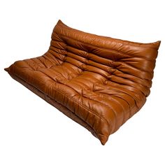 a brown leather futon is shown on a white background