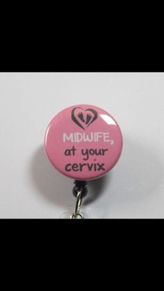 a pink badge with the words midwife at your cervix on it