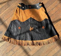 A. C. Lawrence leather co Peabody MA Black & brown Cowgirl and star details Buckles at both sides of waist Overall excellent condition - some minor flaws, see all photos as all sales are final Waist: 26" around and adjustable to be smaller Length: 20.5" 1950s Cowgirl, 70s Cowgirl, Cowgirl Fringe, Western Skirts, Womens Skirts, Western Cowgirls, Fringe Skirt, Western Leather, Dress Inspo