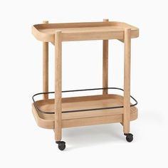 a wooden serving cart with two trays on wheels