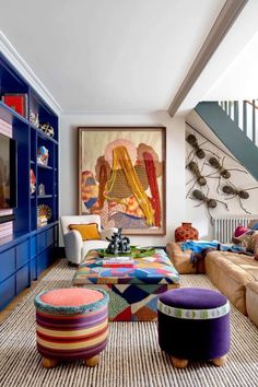 a living room filled with lots of colorful furniture