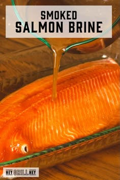 salmon being cooked in a glass dish with the words smoked salmon brine