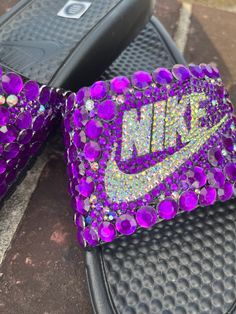 Bling Nike Women's Benassi JDI (Black) 💜 Let me help you bring your custom creations to life! The possibilities are endless and I am open to creating any design that you have in mind. These are great for weddings, gifts for her, special events, or just everyday wear. 💜When placing your order please specify your desired color of the crystals in the PERSONALIZATION tab above, your crystals can consist of any color I have access to every color. 💜 All designs are handmade and embellished with a variety of high quality crystals. Due to every crystal being hand placed, no two shoes will be exactly alike. Your shoes will be handmade with an adhesive so stones may fall off over a period of time due to wear and tear but you can glue it back into place if need be. I will include extra rhinestones Bling Nike Shoes, Weddings Gifts, Nike Slides, Custom Bling, Pink Swarovski, Bling Shoes, Glitter Shoes, Shoe Gifts, Womens Slides