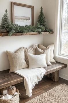 a wooden bench sitting next to a window filled with pillows and greenery on top of it