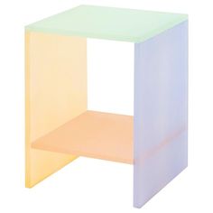 a white and yellow side table on a white background