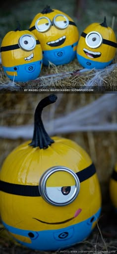 some yellow and blue painted pumpkins with eyes on them sitting in hay bales