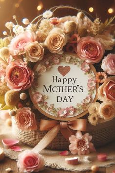 a basket filled with flowers and a happy mother's day sign in the center