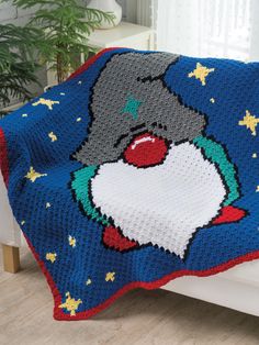 a crocheted blanket with a cartoon character on it