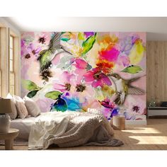 a colorful floral wall mural in a living room