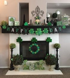 a mantel decorated with green decorations for st patrick's day