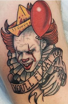 a close up of a person with a tattoo on their leg and a clown face