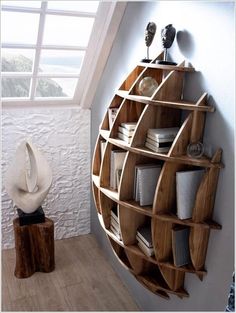 a wooden shelf with books on it and a white hat sitting on top of it