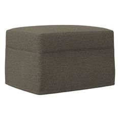 a grey ottoman that is sitting on top of a white surface and it's cover