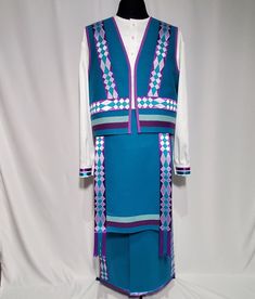 Men's Southern Straight L/XL Colors: turquoise, purple, white  Materials: Trade Cloth 100% wool Iridescent crepe 100% polyester  Applique: Satin 100% polyester  Dimensions: Shirt Sleeve 36.5"   Width 54"   Length 34" Breechclout    Width 14"   Length 22" Trailer  Width 10"  Length 40.5" Vest   Width 48"   Length 22.5" Leggings    Inseam 31.5"   Side length 34" Drop  Top width 6.25"  Bottom width 4.25"  Length 57" Ribbon Skirts, Drop Top, Mens Costumes, Shirt Sleeves, Art Collection, Bathing Beauties, Turquoise, Mens Outfits, Purses And Bags