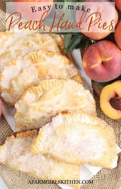 peach hand pies with powdered sugar on top and fresh peaches in the background